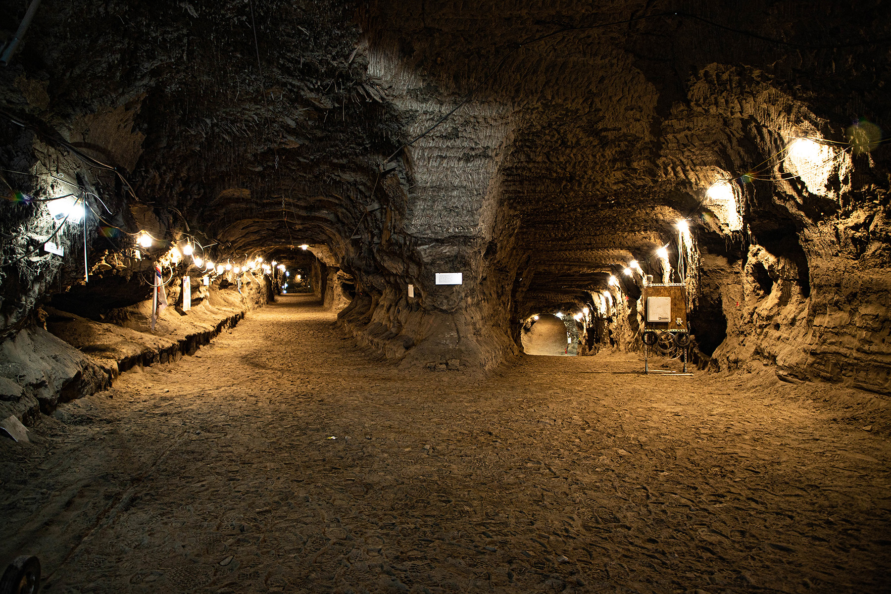 Two well-lit tunnels diverge in the permafrost.